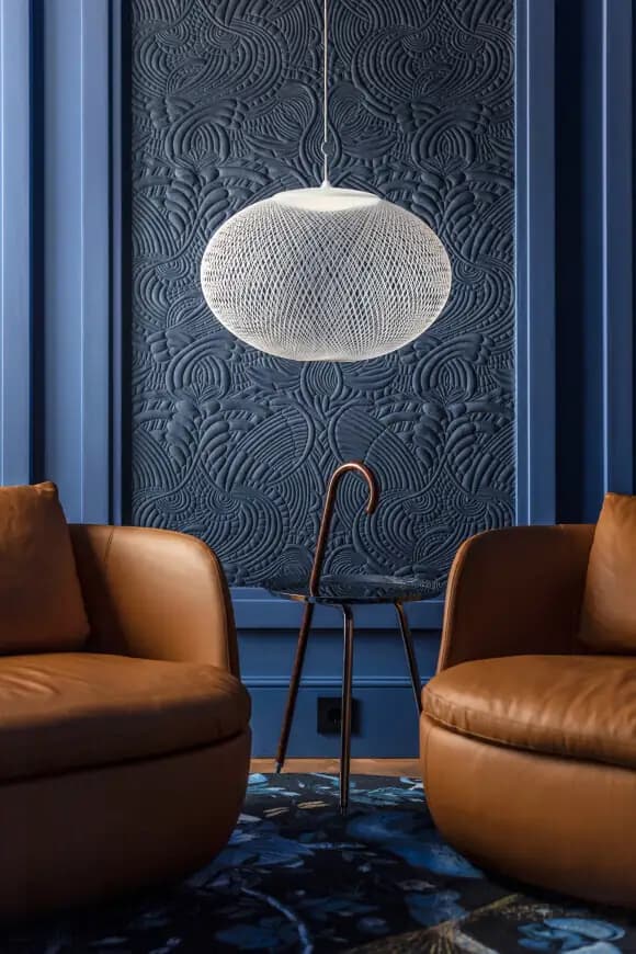 Blue embossed wall material in a hotel space