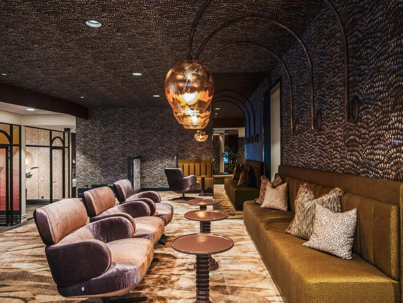 Expressive lounge with patterned walls and ceiling